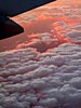 Clouds tipped with the setting sun, 39000 feet above utah