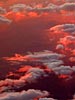 Clouds tipped with the setting sun, 39000 feet above utah