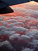 Clouds tipped with the setting sun, 39000 feet above utah